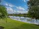 Lush grassy lawn with beautiful pond and serene water view at 5243 Esplanade Blvd, Bradenton, FL 34211