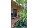 Inviting outdoor patio surrounded by green plants at 7522 Gallineta Ct # 7522, Tampa, FL 33615