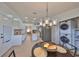 Bright dining area with laundry facilities and chandelier at 902 Mcdaniel St # 1, Sun City Center, FL 33573