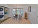 Cozy dining area with a table and laundry area nearby at 902 Mcdaniel St # 1, Sun City Center, FL 33573