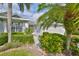 Landscaped front yard with walkway leading to the home entrance at 902 Mcdaniel St # 1, Sun City Center, FL 33573
