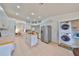 Kitchen with island, stainless steel appliances, and laundry area at 902 Mcdaniel St # 1, Sun City Center, FL 33573