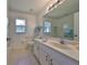 Clean bathroom with single sink vanity and tile floor at 902 Mcdaniel St # 1, Sun City Center, FL 33573