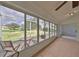 Sunroom with view of the backyard and patio furniture at 902 Mcdaniel St # 1, Sun City Center, FL 33573