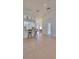 View of the living area with access to kitchen and other rooms at 902 Mcdaniel St # 1, Sun City Center, FL 33573
