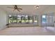 Bright sunroom with view of backyard and sliding glass doors at 902 Mcdaniel St # 1, Sun City Center, FL 33573