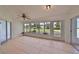 Sunroom with tile floors, multiple windows, and access to patio at 902 Mcdaniel St # 1, Sun City Center, FL 33573
