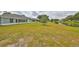 Spacious backyard with pond view and lush grass at 902 Mcdaniel St # 1, Sun City Center, FL 33573
