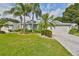 Single-story home with a landscaped yard, driveway, and attached garage at 902 Mcdaniel St # 1, Sun City Center, FL 33573