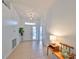 Bright and spacious entryway with tile flooring and a bench at 902 Mcdaniel St # 1, Sun City Center, FL 33573