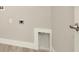 Simple laundry room with white trim and grey walls at 10520 Purple Thistle Way, San Antonio, FL 33576