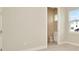 Bright bedroom with ensuite bathroom and carpet flooring at 10520 Purple Thistle Way, San Antonio, FL 33576