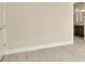 Bright bedroom with neutral walls and wood-look tile flooring at 10520 Purple Thistle Way, San Antonio, FL 33576