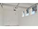 Garage with automatic door opener and overhead storage at 10520 Purple Thistle Way, San Antonio, FL 33576