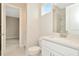 Clean bathroom with white vanity and shower at 10520 Purple Thistle Way, San Antonio, FL 33576