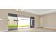 Living area with sliding glass doors leading to backyard at 10520 Purple Thistle Way, San Antonio, FL 33576
