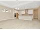 Open concept kitchen with island and stainless steel appliances at 10520 Purple Thistle Way, San Antonio, FL 33576