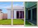 Sliding glass doors offer backyard access and views of a neighboring home at 10520 Purple Thistle Way, San Antonio, FL 33576