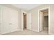 Spacious bedroom with double doors and wall-to-wall carpet at 10520 Purple Thistle Way, San Antonio, FL 33576