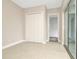 Bright bedroom with double doors and access to a private patio at 10520 Purple Thistle Way, San Antonio, FL 33576