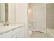 Clean bathroom with white vanity and bathtub at 10520 Purple Thistle Way, San Antonio, FL 33576