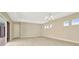 Living room with sliding glass doors and access to patio at 10520 Purple Thistle Way, San Antonio, FL 33576
