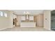 Bright kitchen with white cabinets, stainless steel appliances, and quartz countertops at 10520 Purple Thistle Way, San Antonio, FL 33576