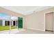 Bedroom with sliding glass doors opening to a private courtyard at 10520 Purple Thistle Way, San Antonio, FL 33576