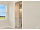 Bedroom with ensuite bathroom and a view at 10520 Purple Thistle Way, San Antonio, FL 33576