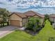 Attractive single-story home with tile roof and landscaped yard at 5243 Esplanade Blvd, Bradenton, FL 34211