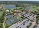 Community tennis courts and clubhouse near parking at 5243 Esplanade Blvd, Bradenton, FL 34211