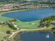 Aerial view of upscale community with golf course, lake, and luxury homes at 5243 Esplanade Blvd, Bradenton, FL 34211