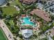 Resort-style pool with numerous lounge chairs and palm trees at 5243 Esplanade Blvd, Bradenton, FL 34211