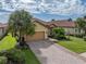 Attractive single-story home with tile roof and landscaped yard at 5243 Esplanade Blvd, Bradenton, FL 34211