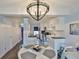 Charming dining area with a round table and white chairs at 4790 Snook Se Dr, St Petersburg, FL 33705