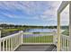 Balcony overlooking a peaceful lake and lush greenery at 4790 Snook Se Dr, St Petersburg, FL 33705