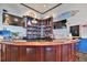 Large bar with wood finish and extensive liquor selection at 4790 Snook Se Dr, St Petersburg, FL 33705