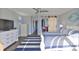 Bedroom with barn door to laundry and ensuite closet at 4790 Snook Se Dr, St Petersburg, FL 33705