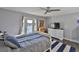 Bedroom with water view, sliding door to balcony, and stylish decor at 4790 Snook Se Dr, St Petersburg, FL 33705
