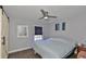 Bedroom with mirror, ceiling fan and window at 4790 Snook Se Dr, St Petersburg, FL 33705