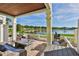 Spacious patio overlooking a lake with wicker furniture at 4790 Snook Se Dr, St Petersburg, FL 33705