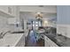 Open concept dining area with a view of the living room and water at 4790 Snook Se Dr, St Petersburg, FL 33705