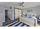 Bedroom with barn door, dresser, and ensuite laundry at 4790 Snook Se Dr, St Petersburg, FL 33705