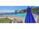 Community pool with lounge chairs and blue umbrella at 4790 Snook Se Dr, St Petersburg, FL 33705