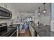 Bright kitchen featuring white shaker cabinets and herringbone backsplash at 4790 Snook Se Dr, St Petersburg, FL 33705