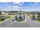 Community entrance with modern gates and landscaping at 20761 Balsam Hill Rd, Land O Lakes, FL 34638