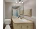 Updated bathroom with vanity, mirror and neutral color scheme at 1154 Barbour Ave, Port Charlotte, FL 33948