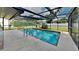 Inviting screened pool area, perfect for relaxation and entertainment at 1154 Barbour Ave, Port Charlotte, FL 33948