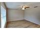 Spacious living room with laminate flooring and neutral wall colors at 1154 Barbour Ave, Port Charlotte, FL 33948