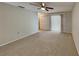 Large bedroom with plush carpeting and a sliding glass door to patio at 1154 Barbour Ave, Port Charlotte, FL 33948